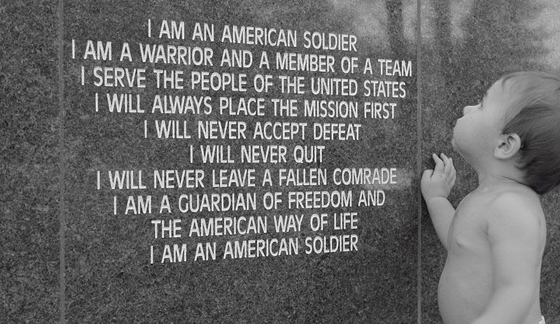 Standing child looking at Soldier's Creed