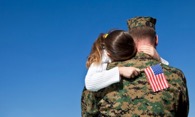 Military Father hugging his Child