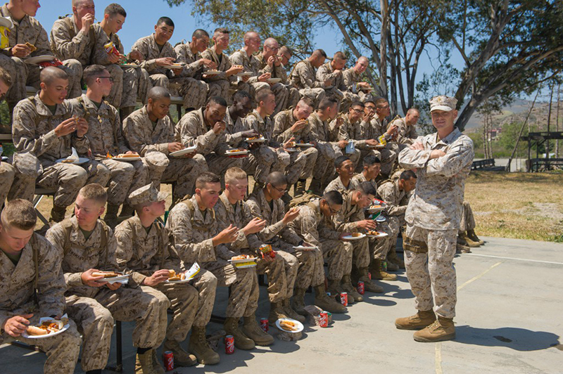 Troops eating hotdogs